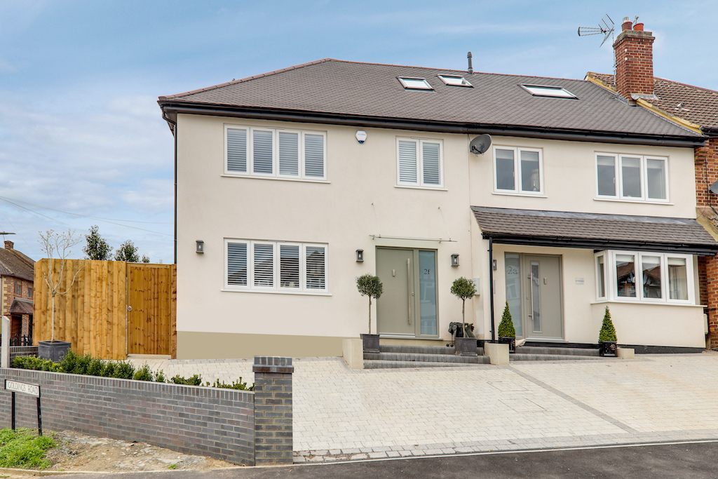 Completed pair of semi-detached houses on Golding Road, Loughton